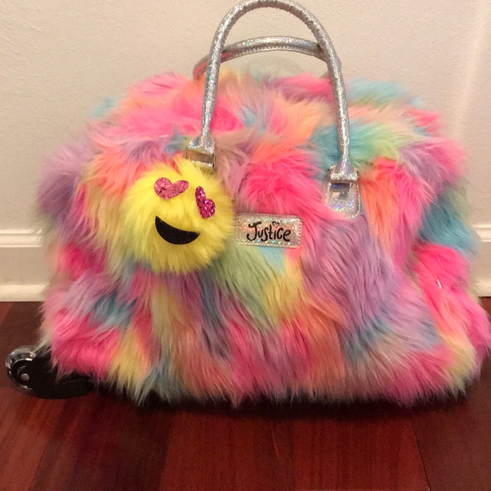 Justice duffel bag with light up wheels.